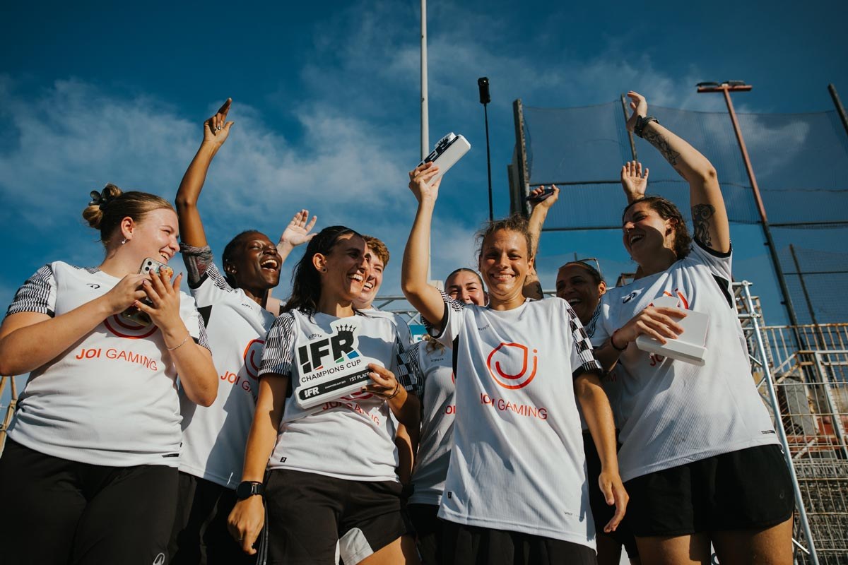 Players celebrating together with the trophy at the IFR Champions Cup.